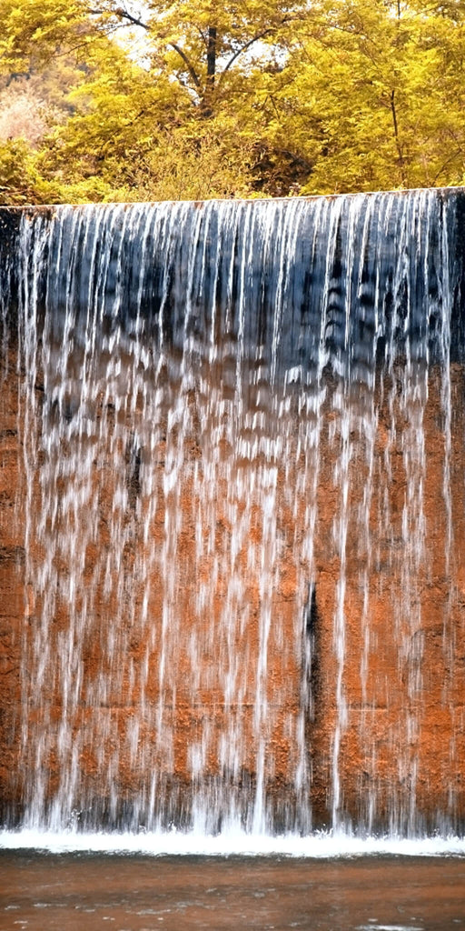 Waterfall Over Rock Cliff